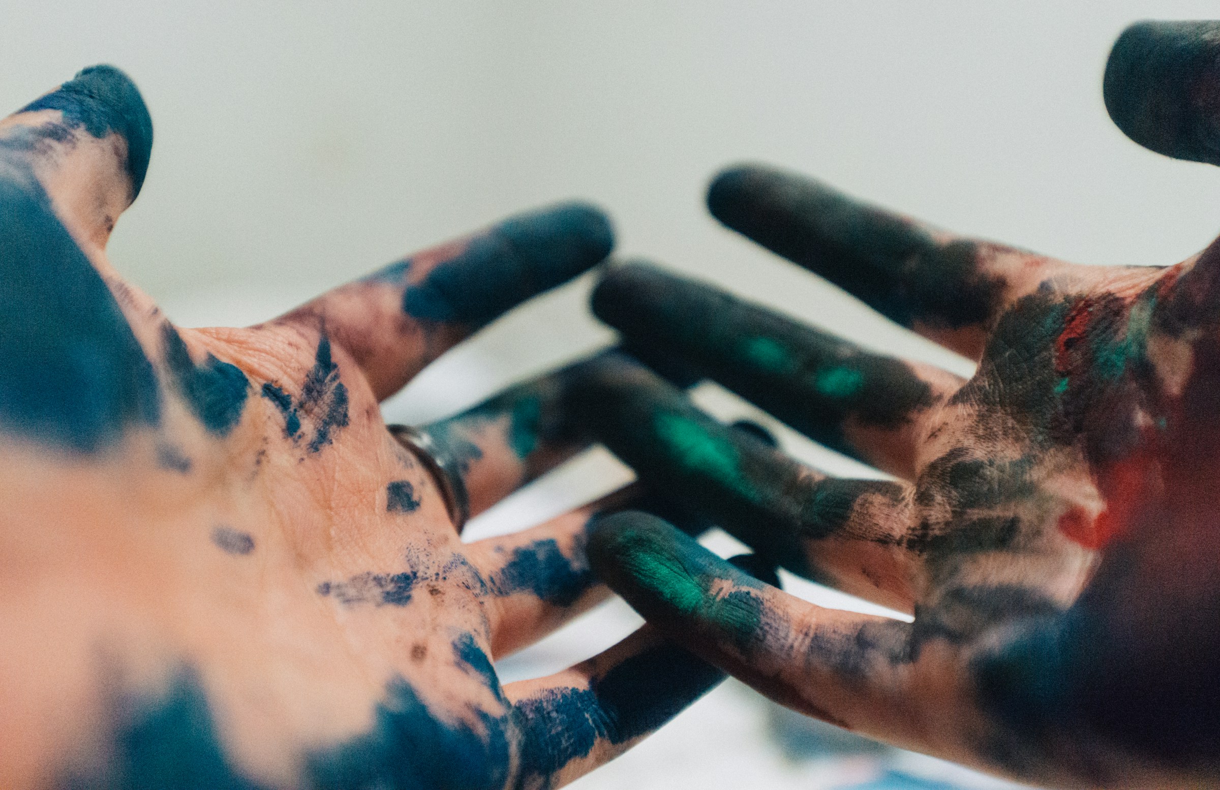 Mans hands with paint